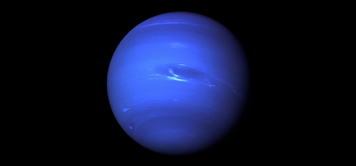 Photograph of a blue planet.