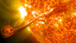 photograph of a stream of material looping off of the sun's surface