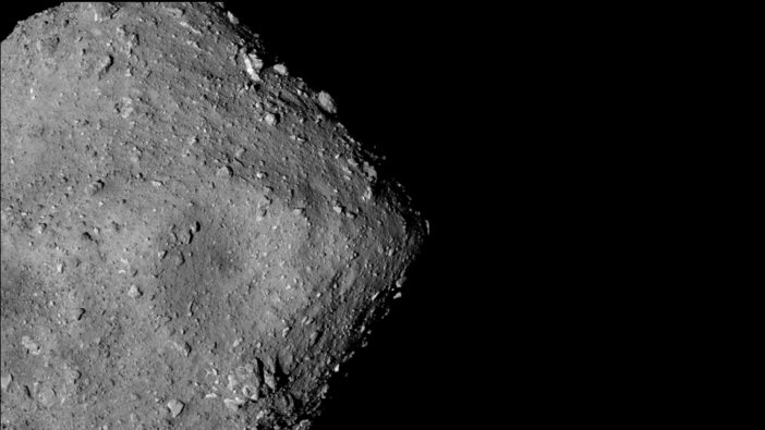 Photograph of the rocky surface of an asteroid.