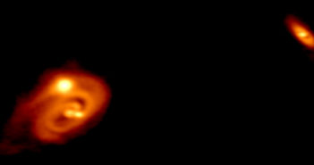 ALMA image of two protostellar systems, one a triple with a disk and the other a wide companion.