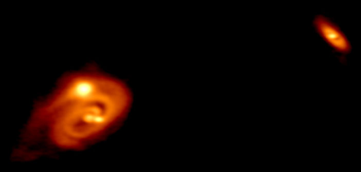 ALMA image of two protostellar systems, one a triple with a disk and the other a wide companion.