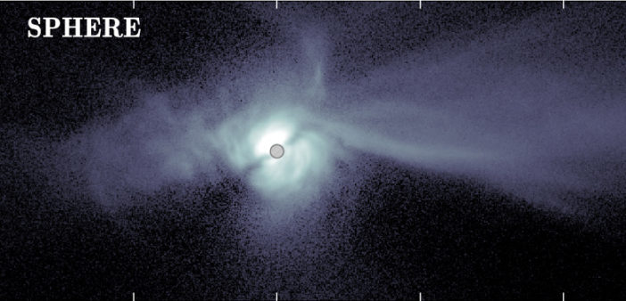Direct image of a bright, blue swirl of material forming a spiral disk with long streamers.