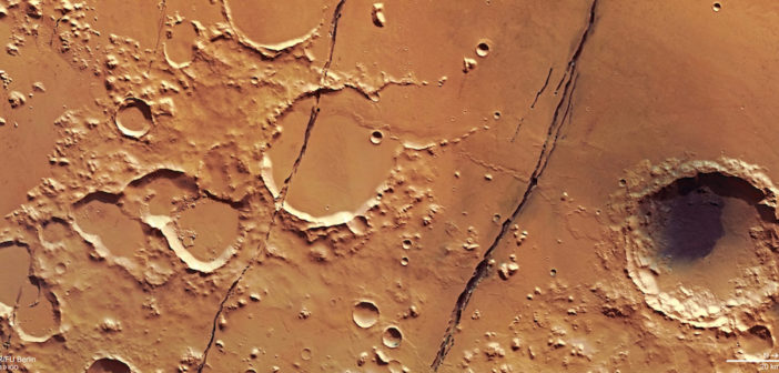 Photo of the craters on mars's surface.