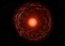 illustration of a large red star surrounded by spherical shells of mass