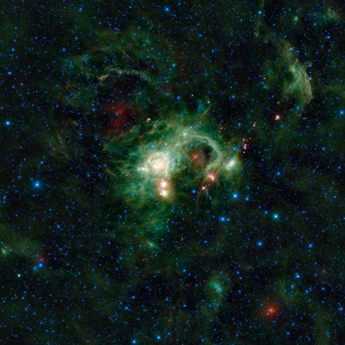 Photograph of a false-colored bright green nebula.