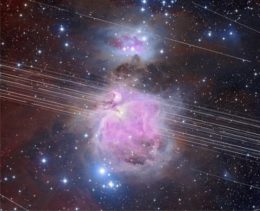 Photograph of a bright, glowing nebula interrupted by a series of white parallel streaks that diagonally span the image.