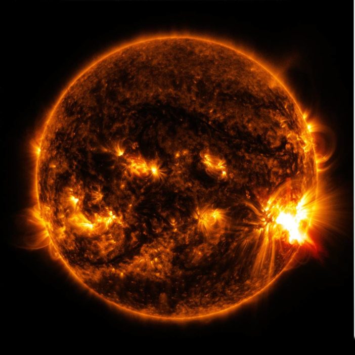 Photograph of the sun that shows a bright region on the right limb.