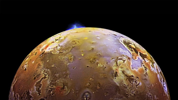 A volcanic eruption appears on the limb of Jupiter's moon Io