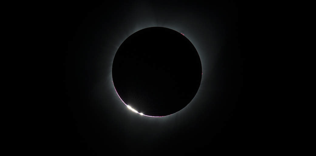Small beads of sunlight during a total solar eclipse