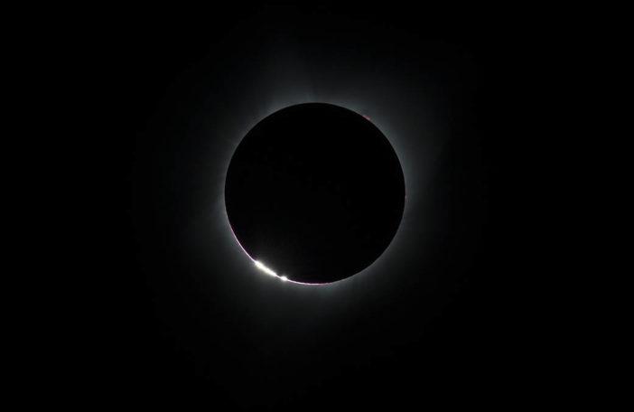 Small beads of sunlight during a total solar eclipse