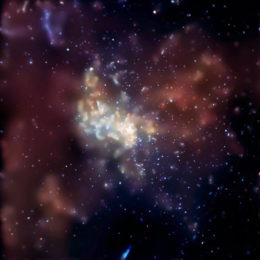 x-ray image of the Milky Way center, featuring bright emission at the center and two lobes of gas to either side,