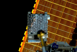 Small array of detectors on a rectangular panel mounted on the International Space Station.