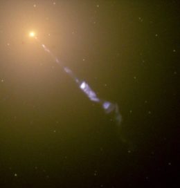 hubble space telescope image of the galaxy M87 and it's particle jet