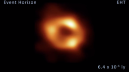 the first image of Sgr A*. The image shows a red-yellow ring on a black background.