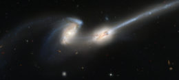 hubble image of interacting galaxies with tidal tails