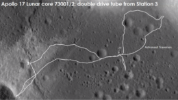 photograph of the lunar surface with the paths taken by astronauts marked in white
