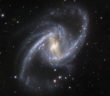 a spiral galaxy with two long, distinct spiral arms and a central bar
