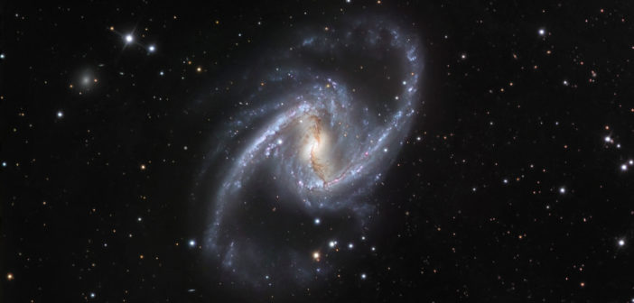 a spiral galaxy with two long, distinct spiral arms and a central bar