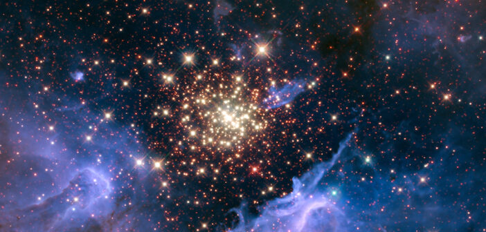 Hubble image of a star cluster surrounded by some wispy gas clouds