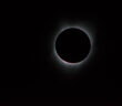 a photograph of a total solar eclipse with the solar corona showing