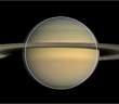 An image of Saturn with a white circle to show the planet's oblateness