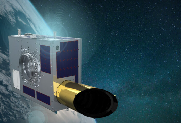 An artist’s rendering of a small satellite in orbit above the earth. A telescope barrel extends from an otherwise uninterrupted rectangular prism.