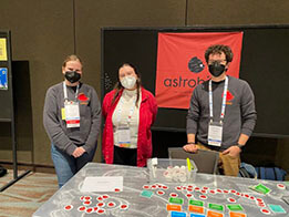 photo of Astrobiters staffing the booth at the grad school fair at AAS 243