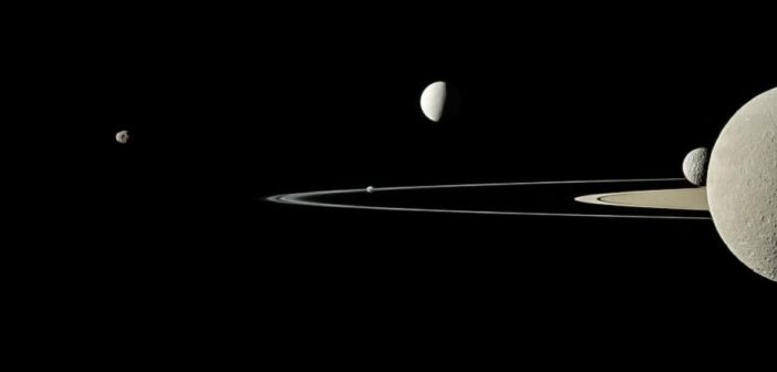 photograph of the rings of Saturn and five of Saturn's moons