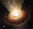 Illustration of a supermassive black hole accreting gas from its surroundings