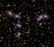 Composite Webb NIRCam image of galaxy cluster Abell 2744, showing the locations of young starburst galaxies.