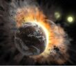 A rendering of two rocky worlds mid-collision, with debris exploding outwards.