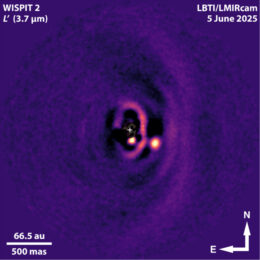 A bright dot beside fainter rings of material.