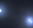 A rendering of three white stars, two of which are very close together.