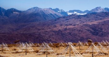 radio antennae in front of a mountain background