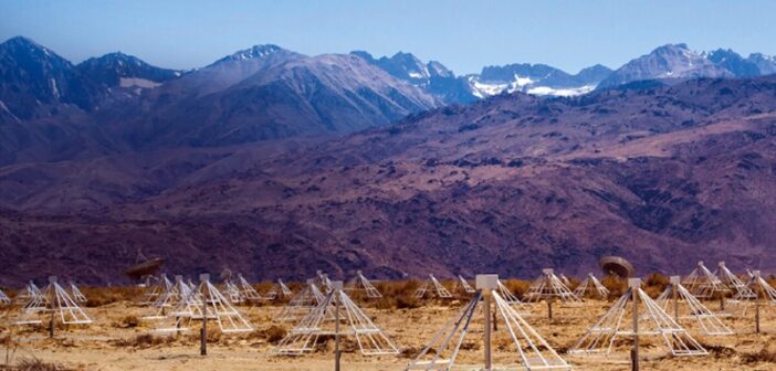 radio antennae in front of a mountain background