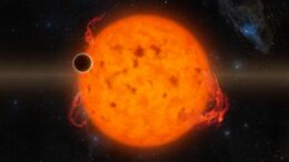 A rendering of a star with lots of spots and flares with a planet in the foreground.