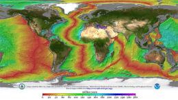 A map of Earth with the continents shown normally but the sea colored according to age.