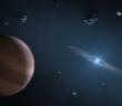 A rendering of a small star surrounded by a ring of gas and some larger asteroids.