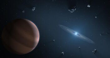 A rendering of a small star surrounded by a ring of gas and some larger asteroids.
