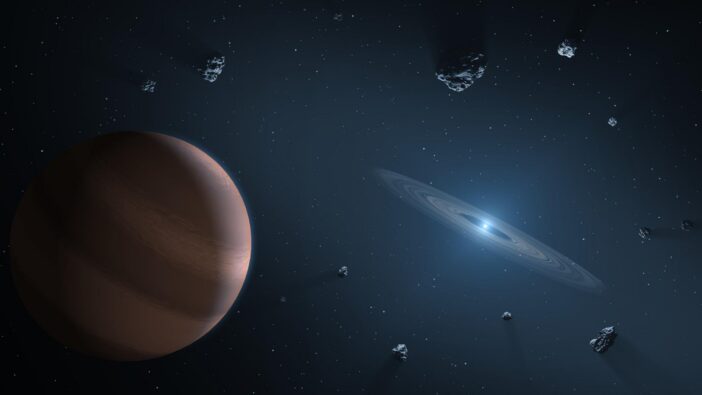 A rendering of a small star surrounded by a ring of gas and some larger asteroids.